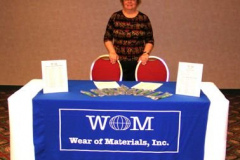 Evelyn Blau staffs the WOM, Inc. booth