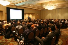 Delegates listen to plenary speaker Robert Carpick