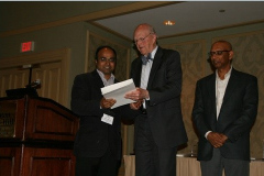 Mathew T. Mathew accepts the Ken Ludema Best Paper Award