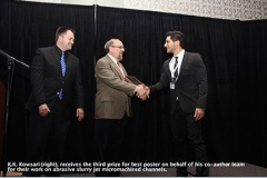 K.K. Kowsari (right), receives the third prize for best poster on behalf of his co-author team for their work on abrasive slurry jet micromachined channels.