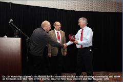 Dr. Ian Hutchings (right) is fecilitated for his extensive service to the tribology community and WOM as he hands over the reins of the journal Wear to Peter Blau (center) and Phil Shipway (left).